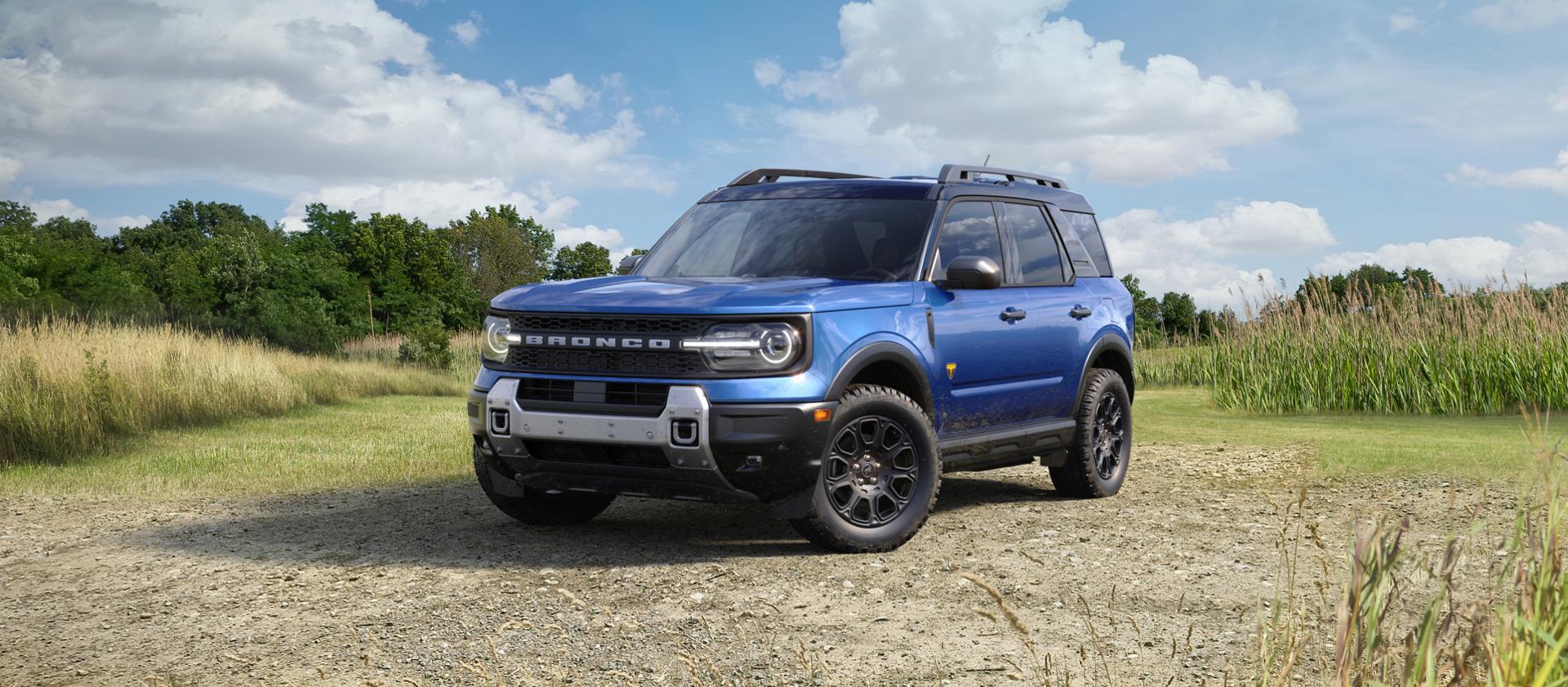 2026 Ford Bronco Sport® parked on a gravel area with trees in the background
