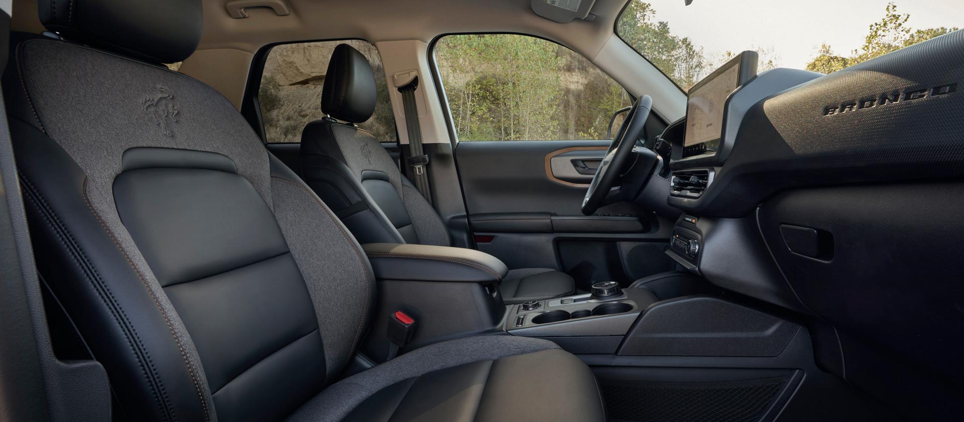 Interior of the vehicle highlighting the seating and the center console screen