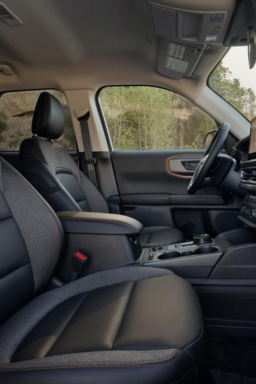Interior of the vehicle highlighting the seating and the center console screen