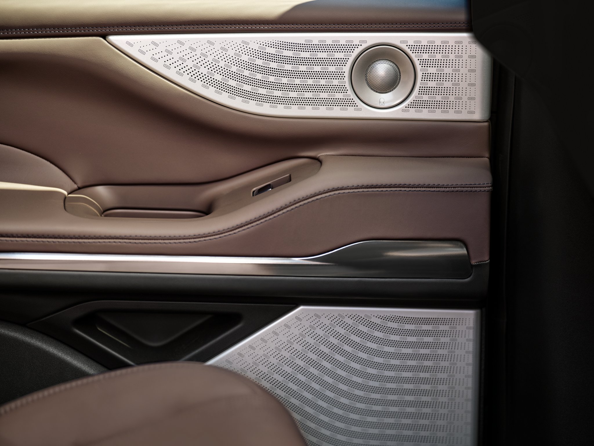 Revel® Ultima speakers are shown in the driver's door of a 2025 Lincoln Navigator® SUV
