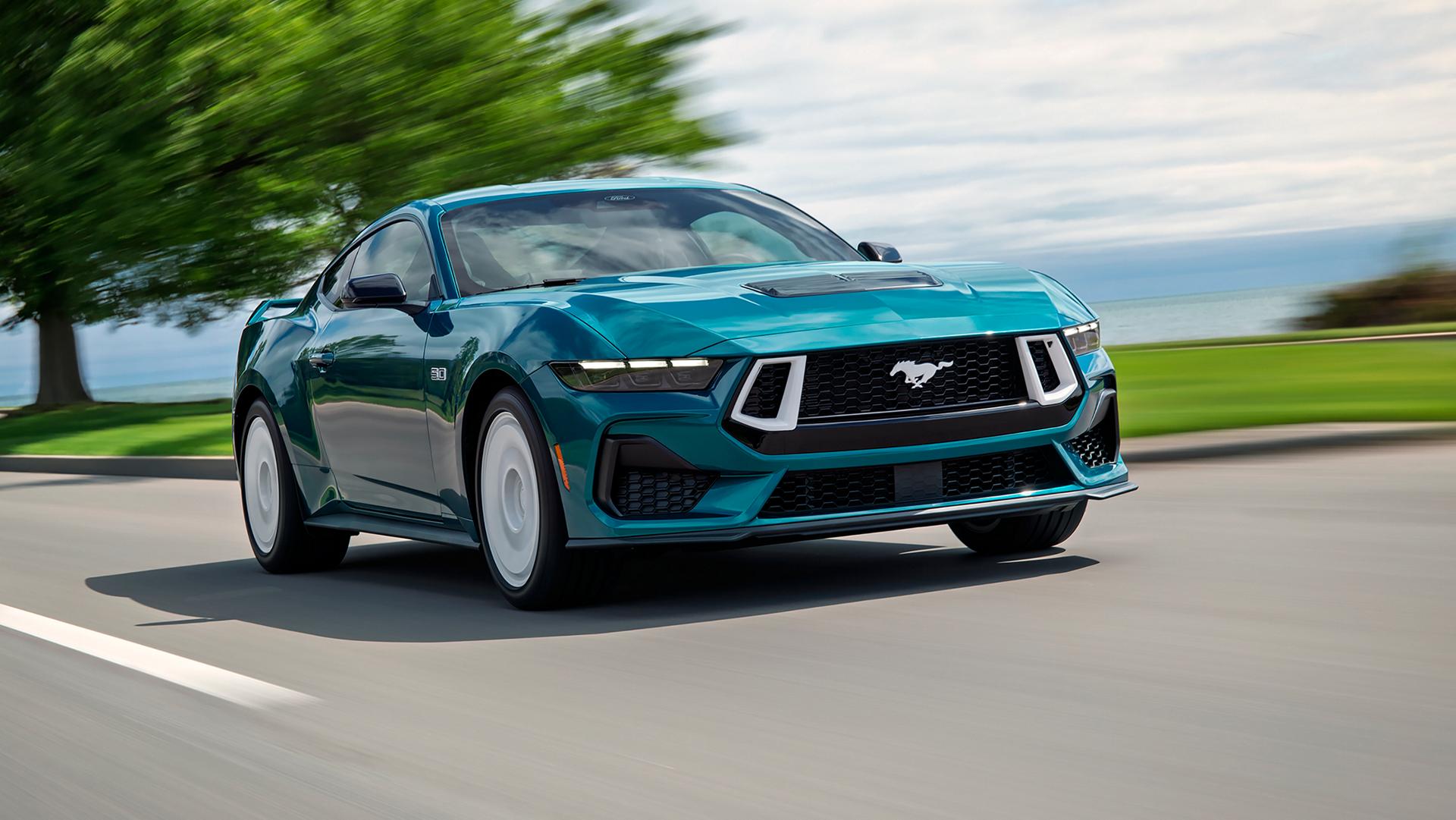 A 2026 Ford Mustang® GT Premium Fastback with the available FX Package being driven near a lake