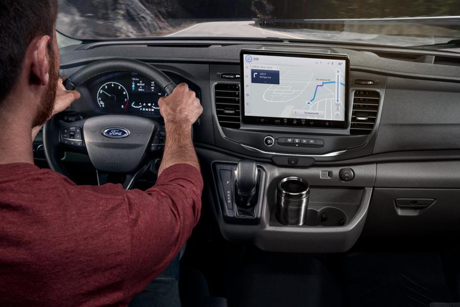 Interior of a 2025 Ford Transit® showing the touchscreen and dashboard