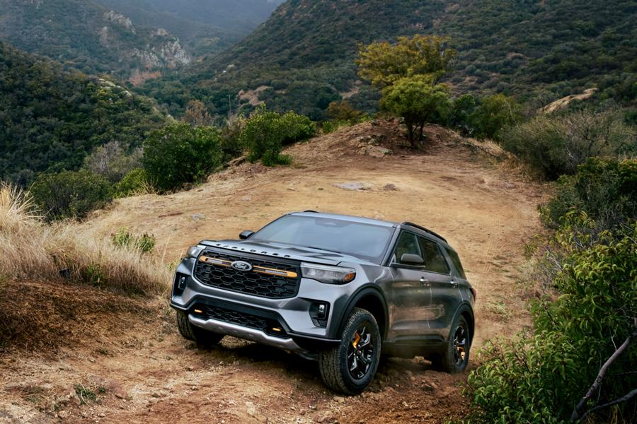 A 2026 Ford Explorer® Tremor® SUV driving on a dusty mountain road