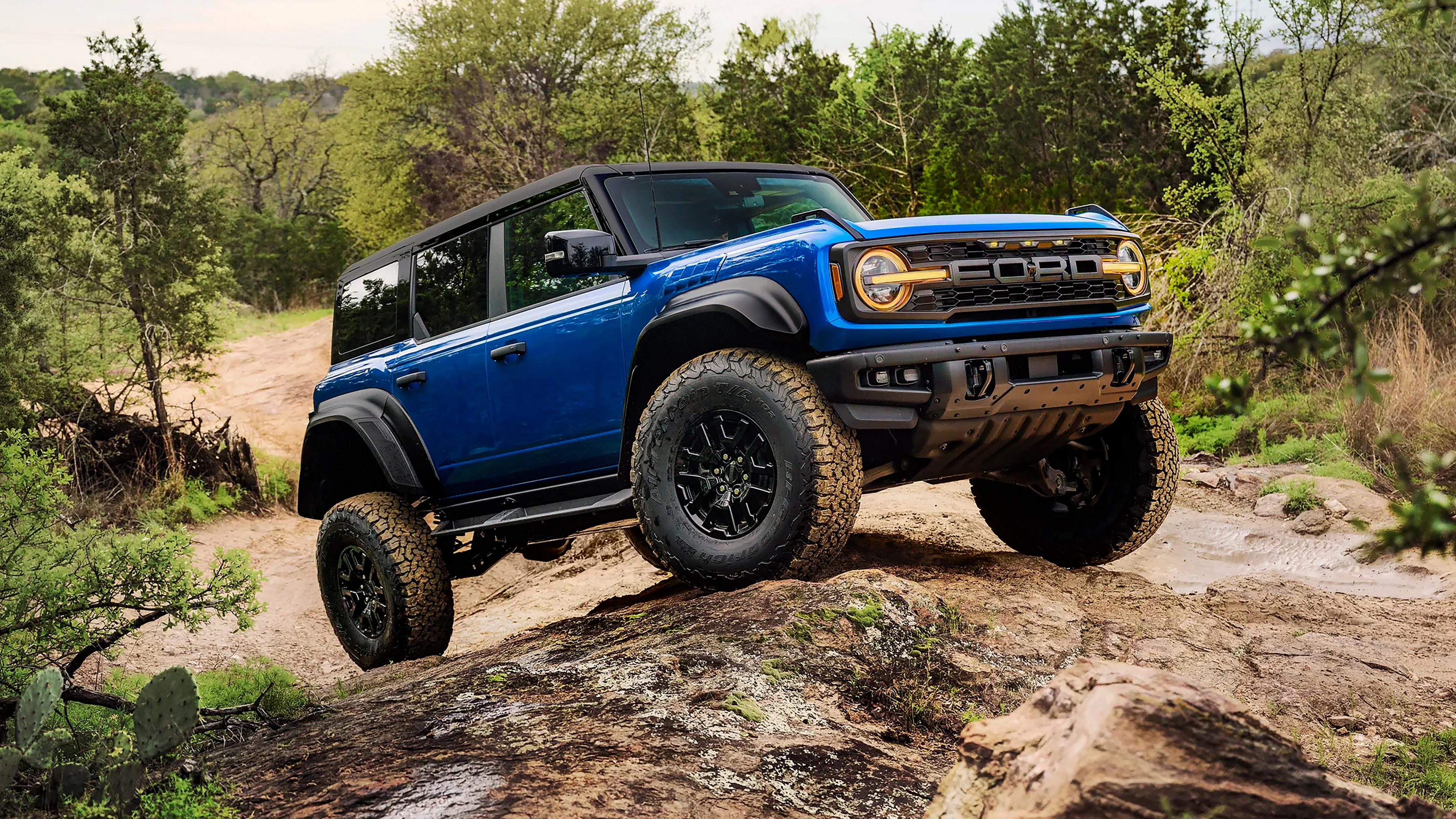 A 2026 Ford Bronco® Raptor® SUV with the available Raptor Black Appearance Package parked on a muddy landscape
