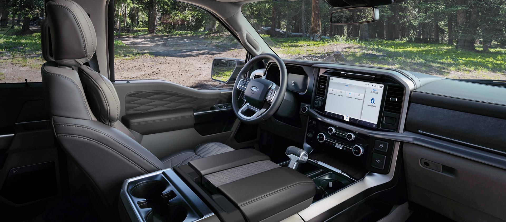 Interior of a 2026 Ford F-150® Platinum® model parked in a wooded setting