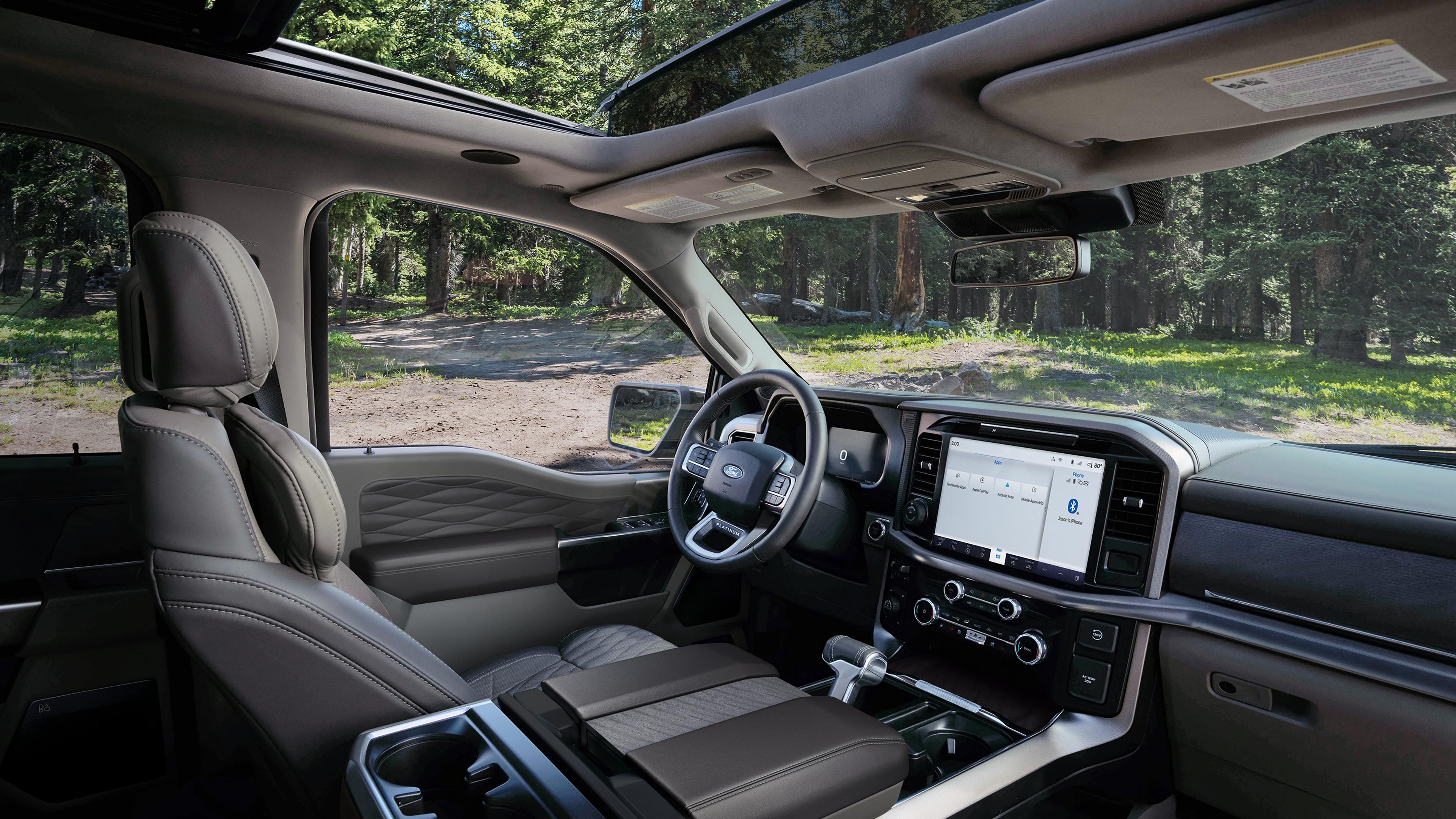 Interior of a 2026 Ford F-150® Platinum® model parked in a wooded setting