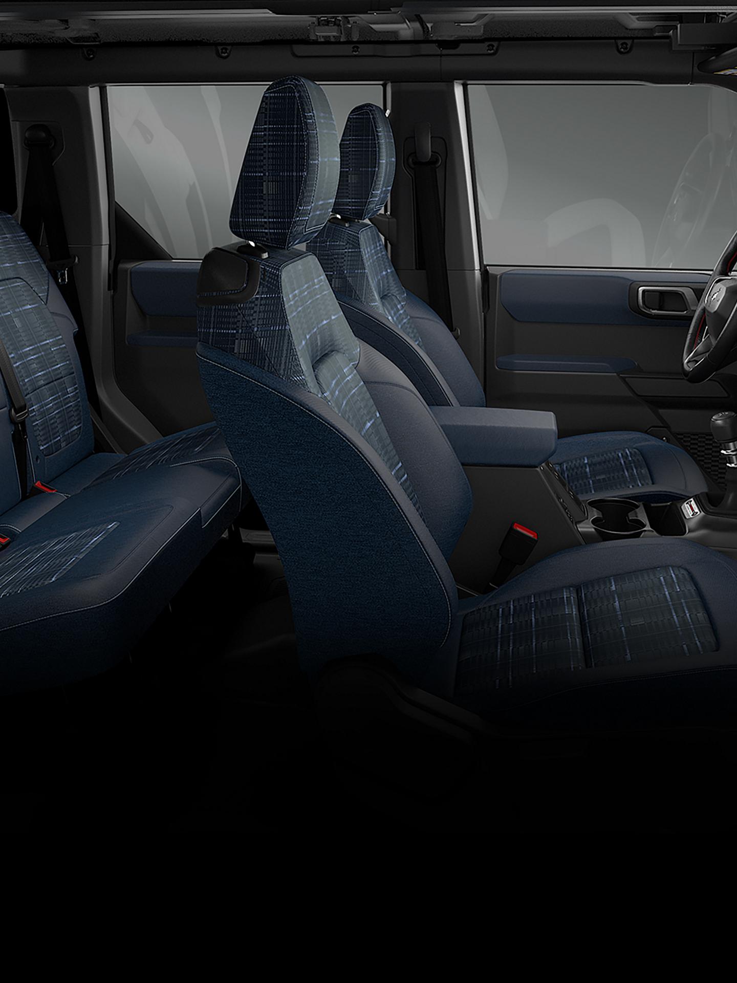 The interior of a 2026 Ford Bronco® Heritage Edition SUV, showing the plaid cloth seats