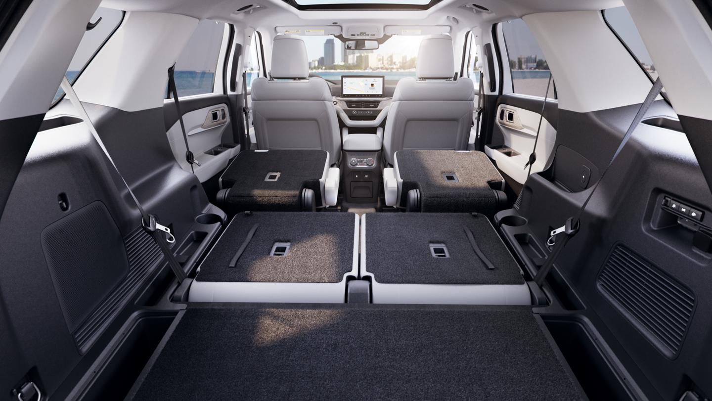 Cargo area of a 2025 Ford Explorer® SUV with second and third row seats folded down flat