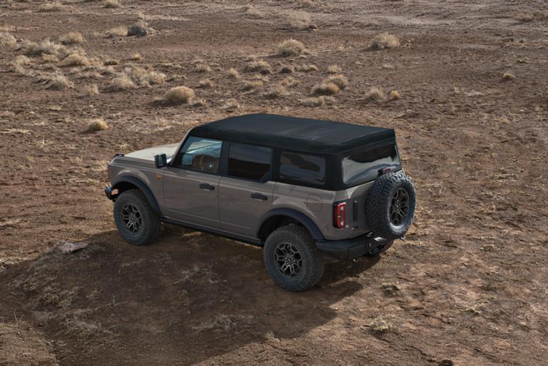 A 2026 Ford Bronco® SUV with the soft top folded back/the hard top removed