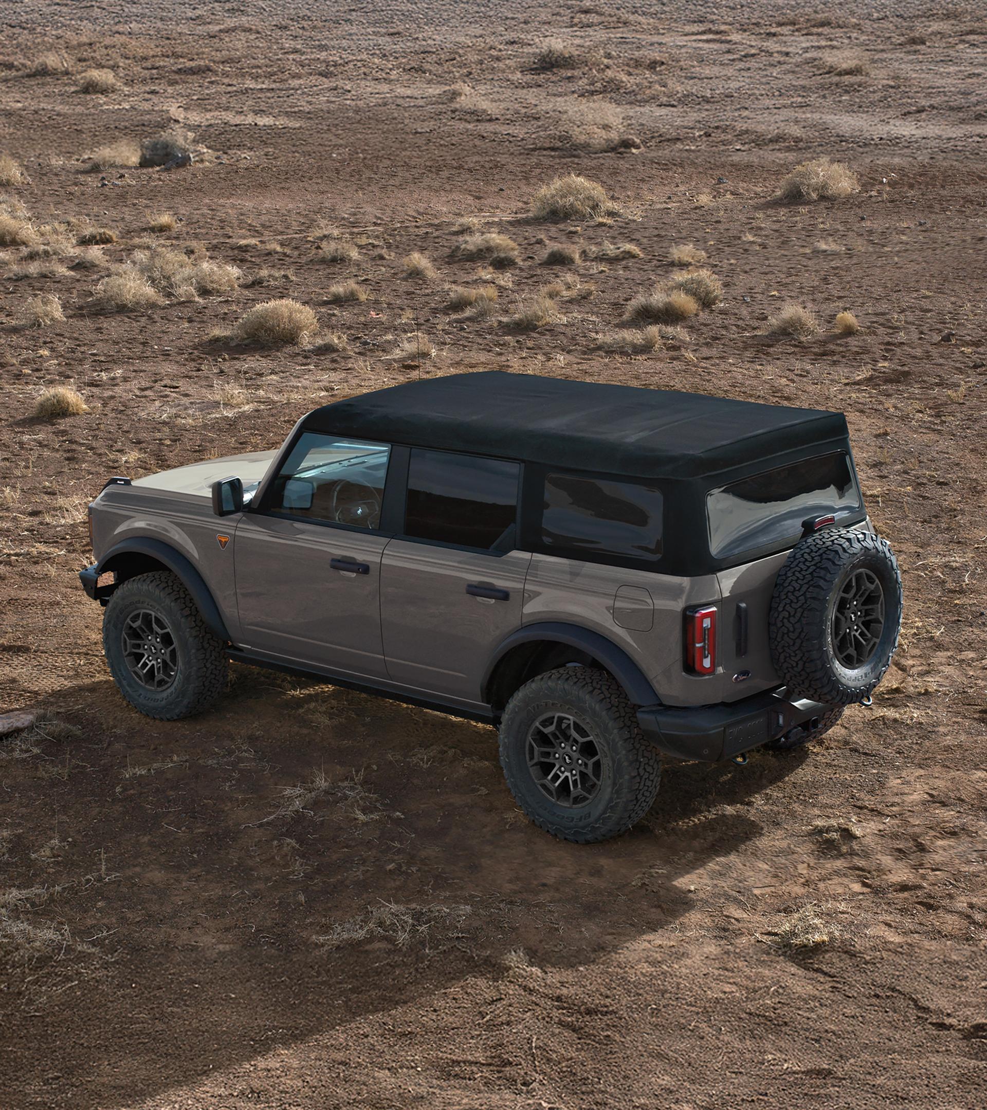 A 2026 Ford Bronco® SUV with the soft top folded back/the hard top removed