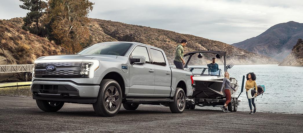 Ford F-150 Lightning truck towing a boat out of the water