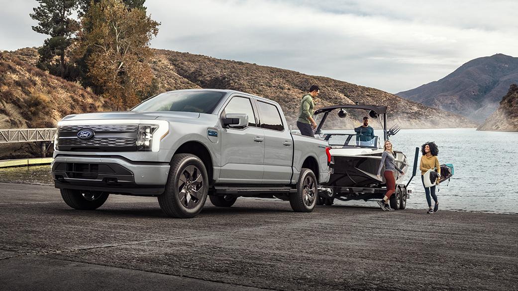 Ford F-150 Lightning truck towing a boat out of the water