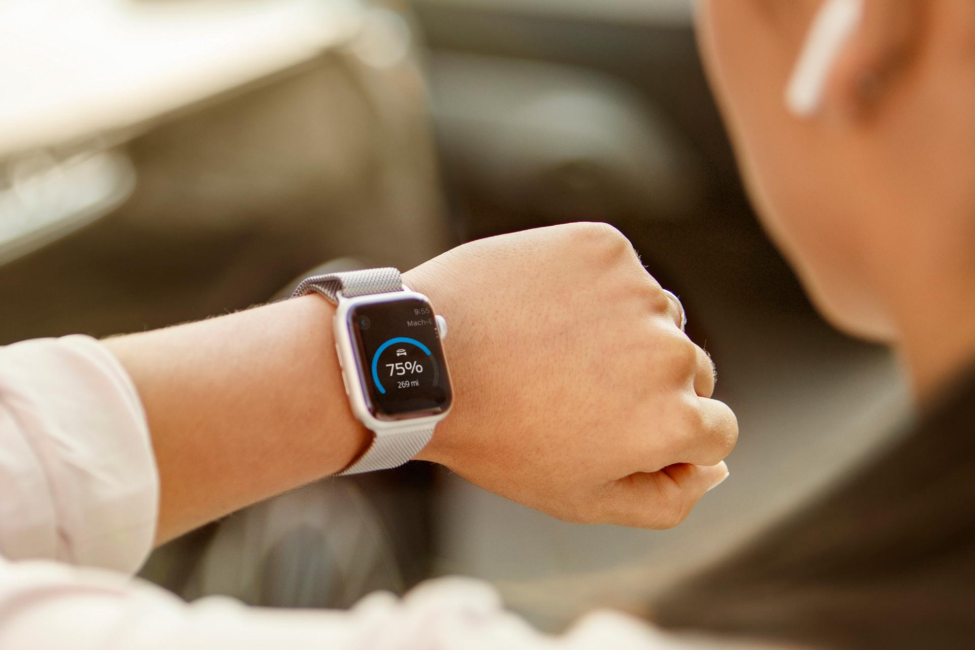Close-up of a wrist with a smartwatch displaying 75%