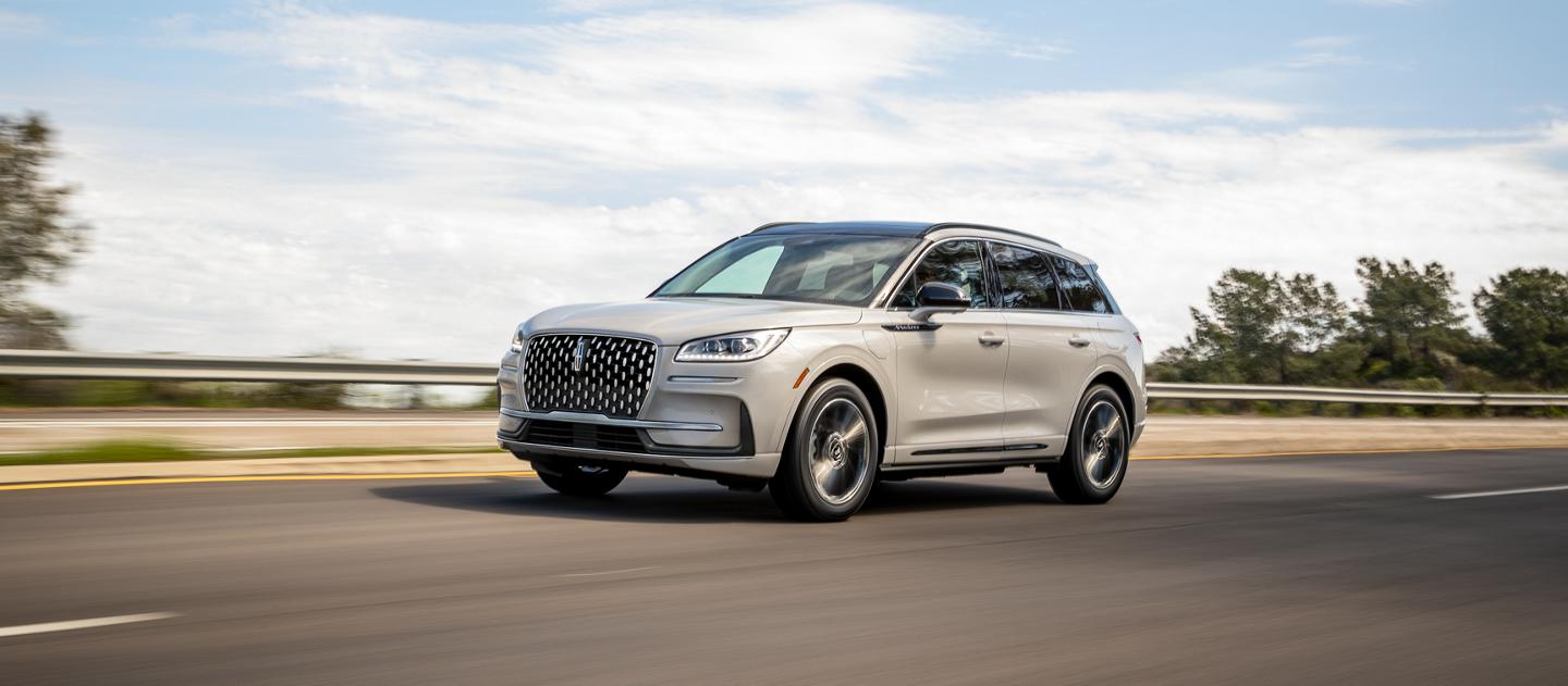 2026 Lincoln Corsair® reserve model with the available Jet Appearance Package is being driven on a highway