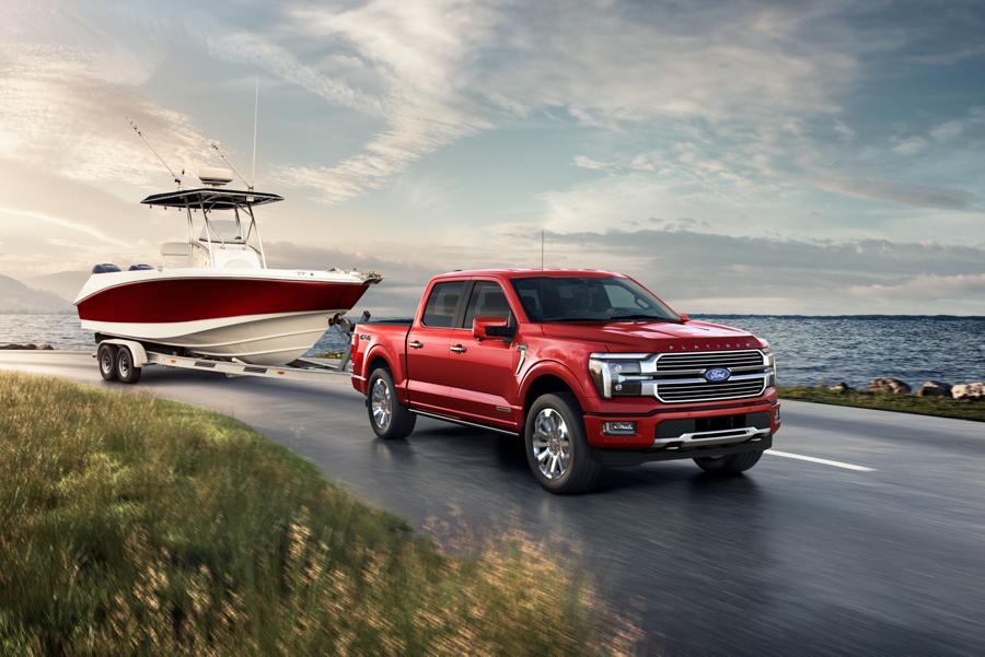A 2025 Ford® F-150® is hauling a boat near a scenic location