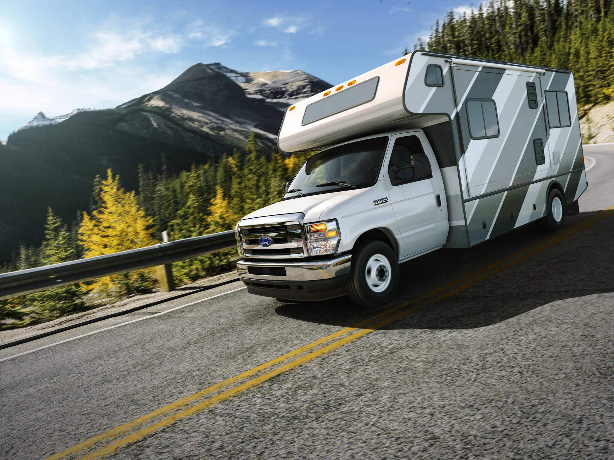 2026 Ford E-Series Cutaway dual-rear-wheel with Class C motorhome package being driven on a bridge