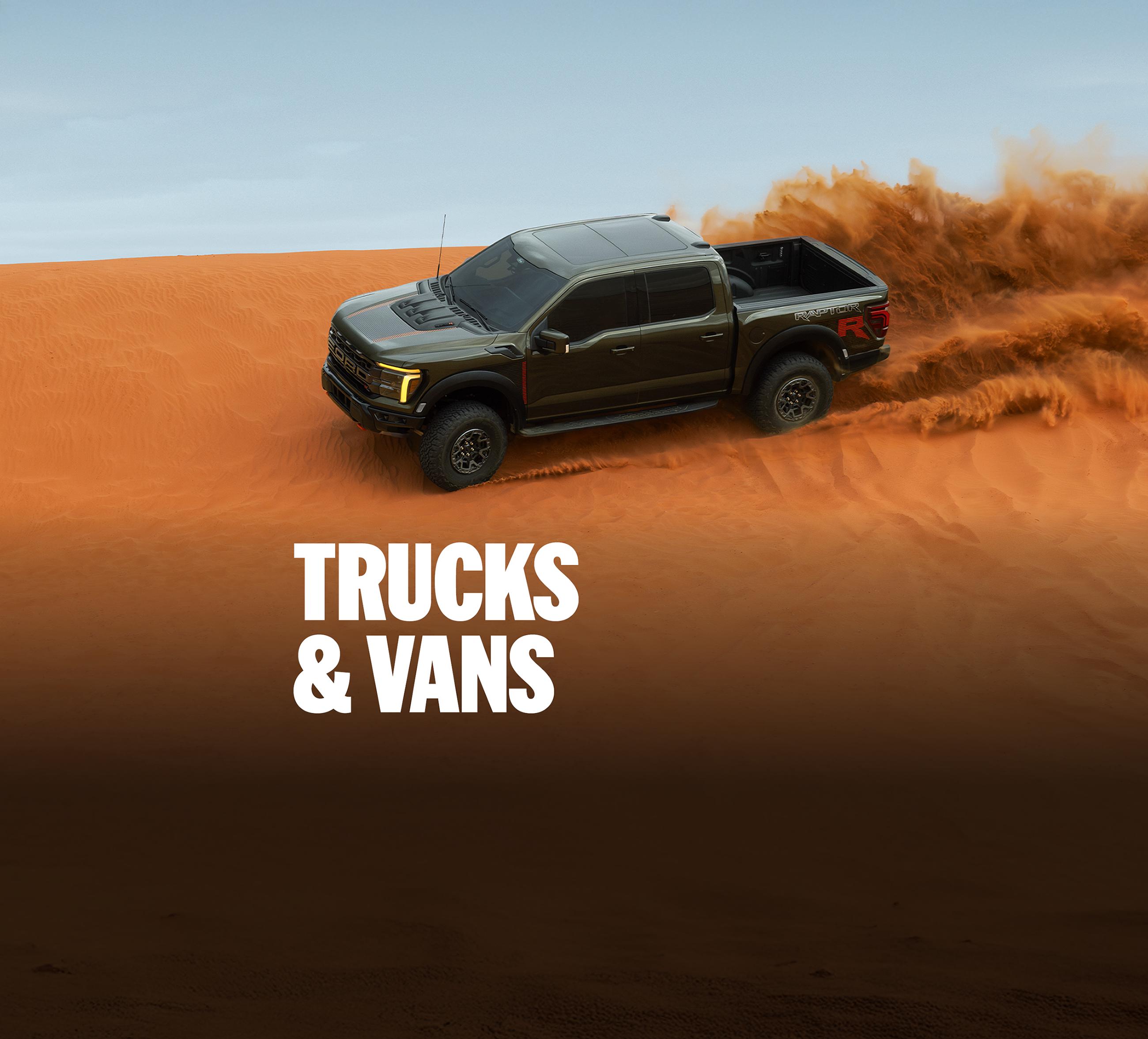 A Ford F-150® truck being driven over a sand dune