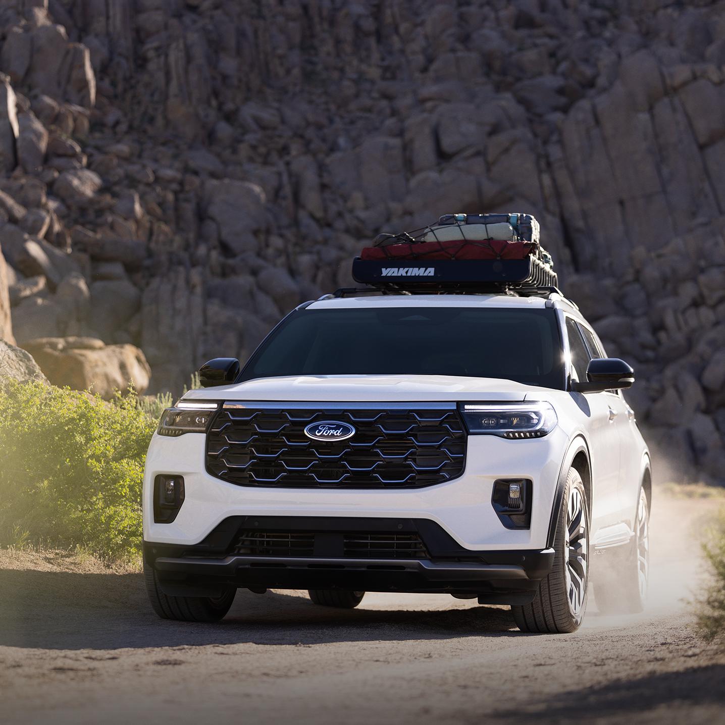 A 2026 Ford Explorer® Platinum™ SUV being driven through a canyon