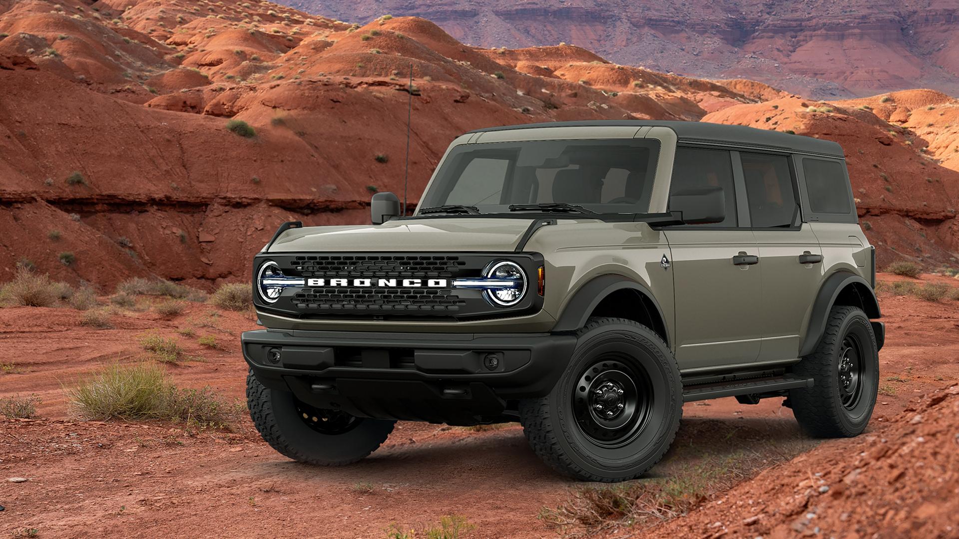 A 2026 Ford Bronco® SUV with the available Black Appearance Package parked in front of a red mesa