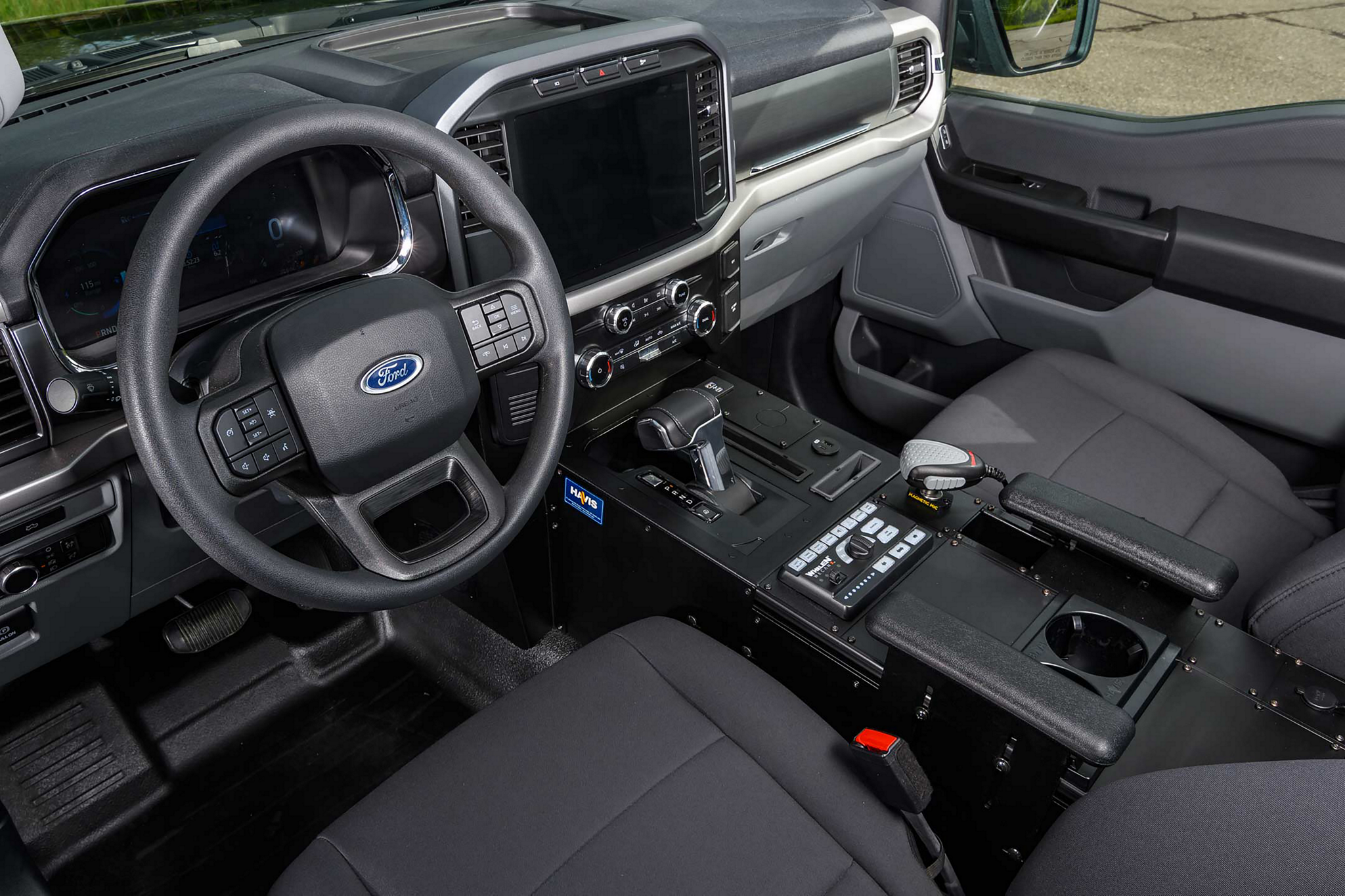 2023 Ford F-150®️ Lightning™️ Pro SSV front row seats and IP panel top tray for equipment mounting