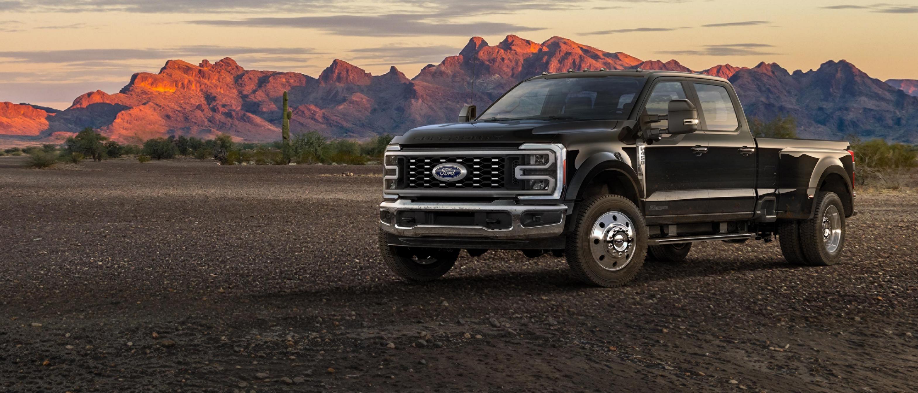 2026 Ford Super Duty® F-450® Lariat® truck parked on a dirt road in the mountains