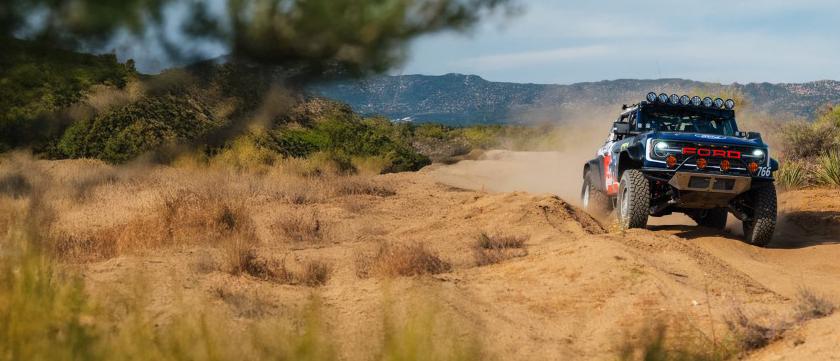 Bronco on a rocky and dusty terrain
