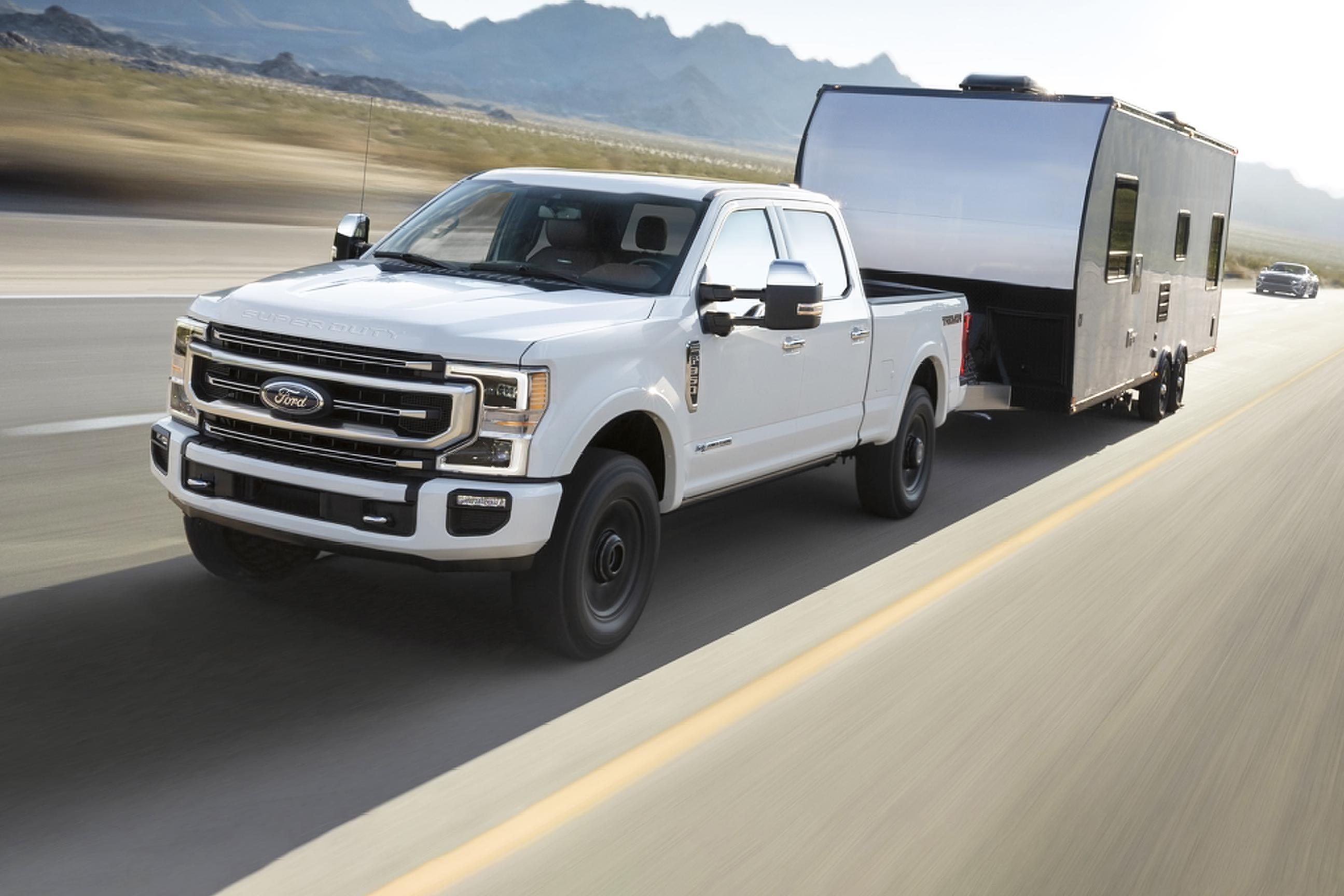 White 2025 Ford Super Duty® truck towing a trailer