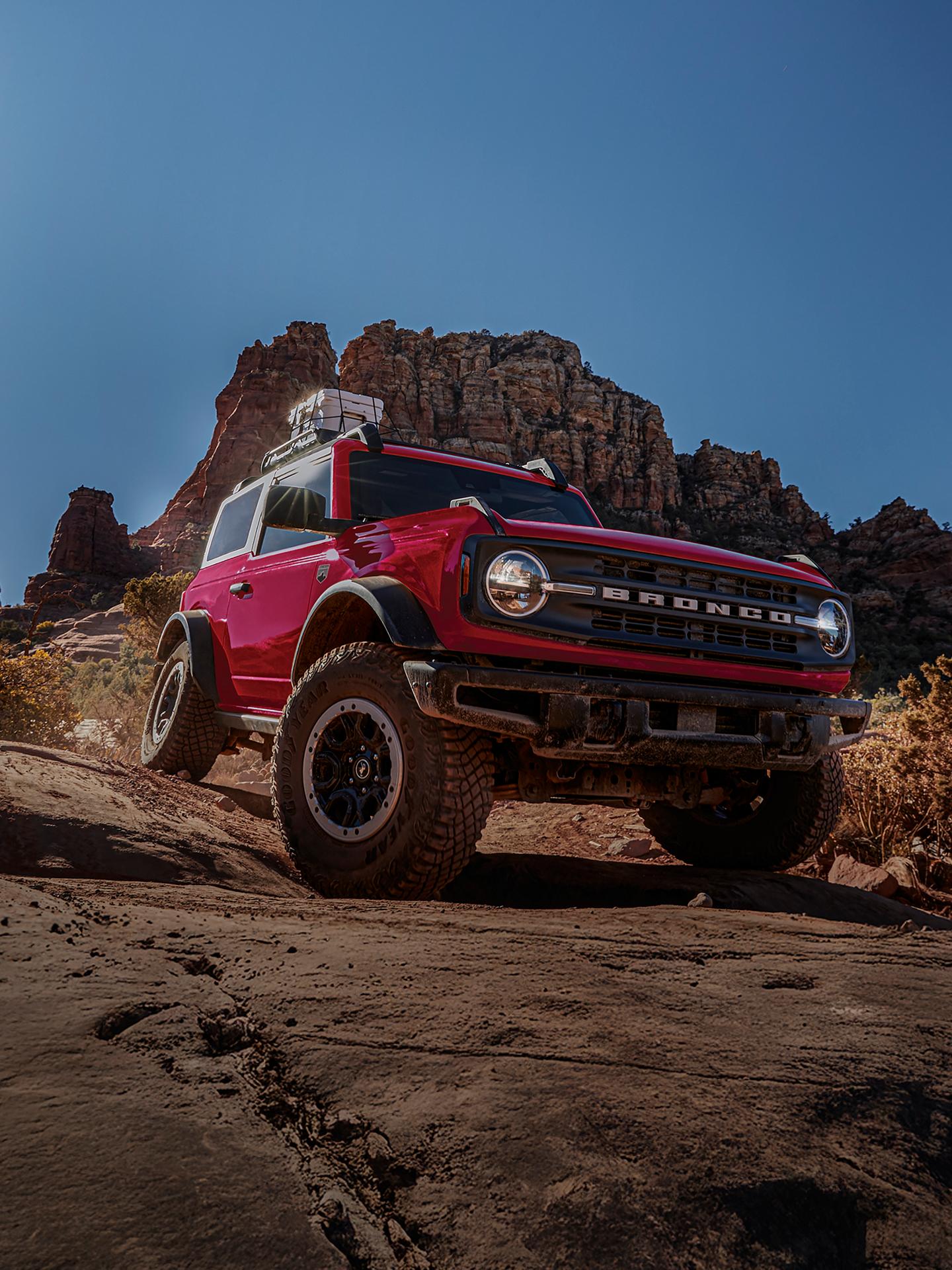 A 2026 Ford Bronco® SUV with the available Sasquatch® Package descending a muddy hill