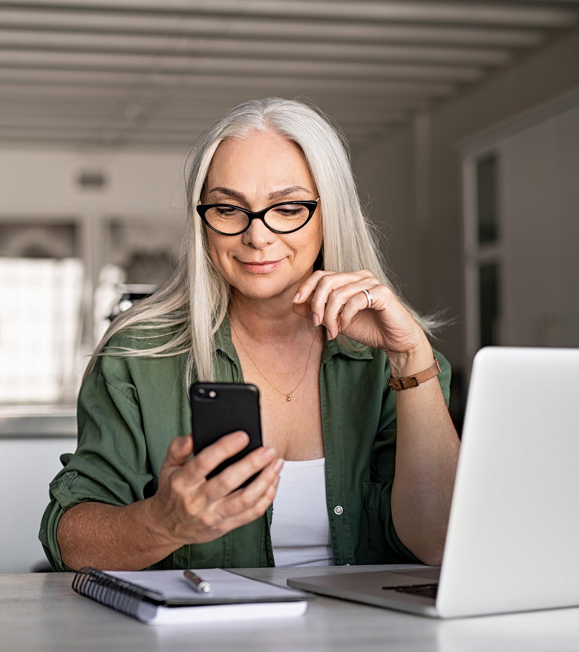 An owner sits at their counter receiving support from their Ford Advisor