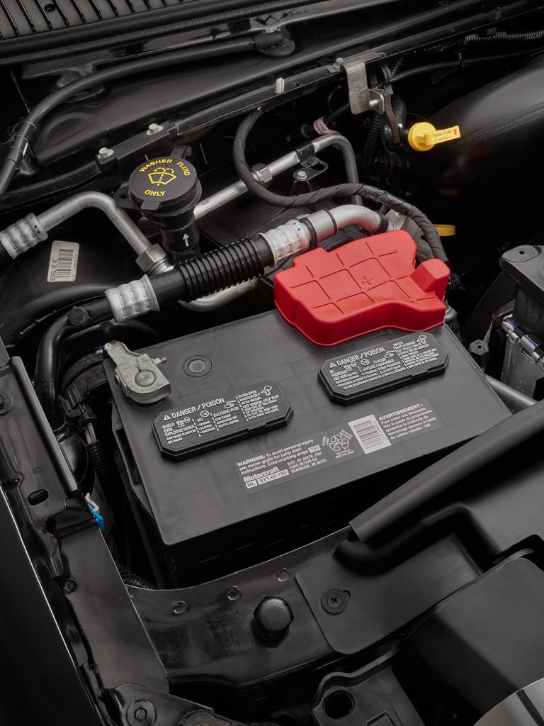 Parts under a vehicle's hood including its battery and more