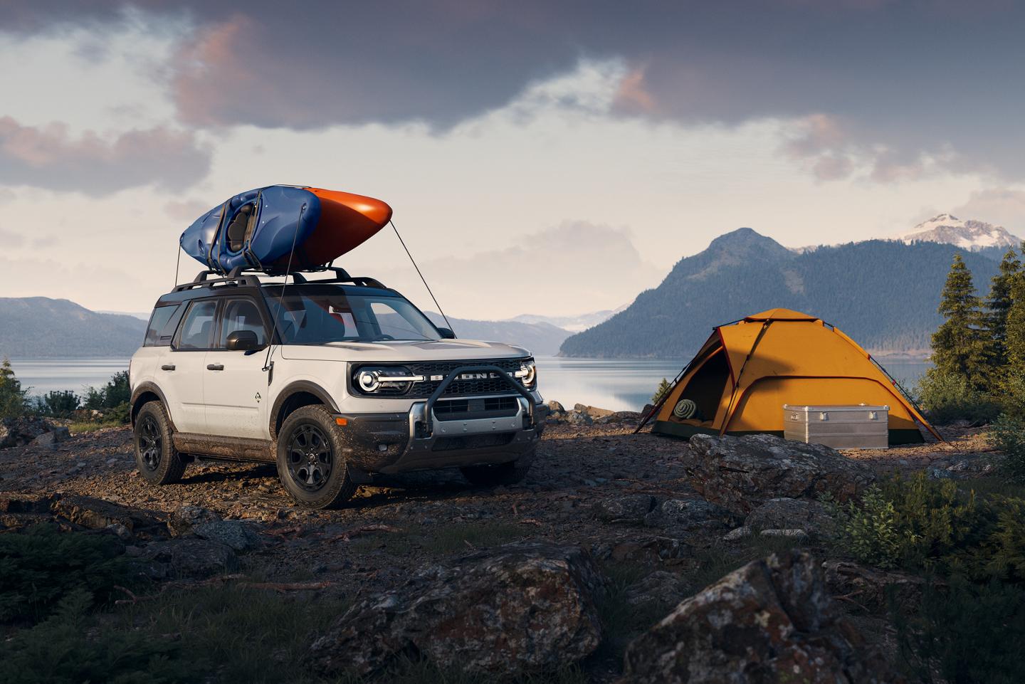 2025 Ford Bronco Sport® parked by a lake with a kayak on the roof