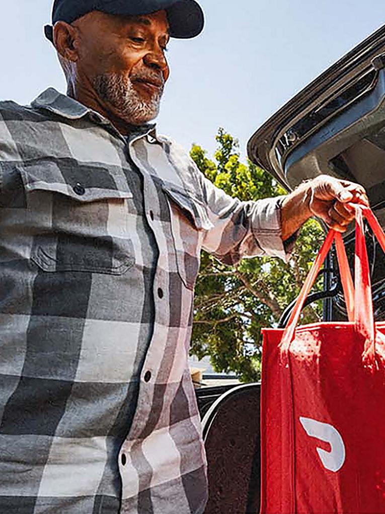 A split image of a Ford volunteer at a Food Bank and a Doordash delivery worker