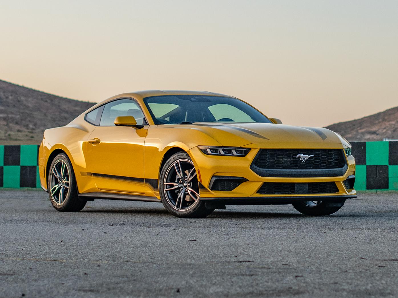 Ford Mustang® EcoBoost® coupe with available Wheel and Stripe package on a racecourse