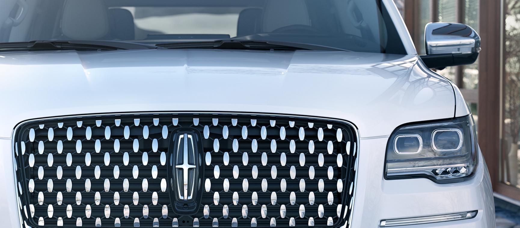 The grille of a Lincoln Navigator.