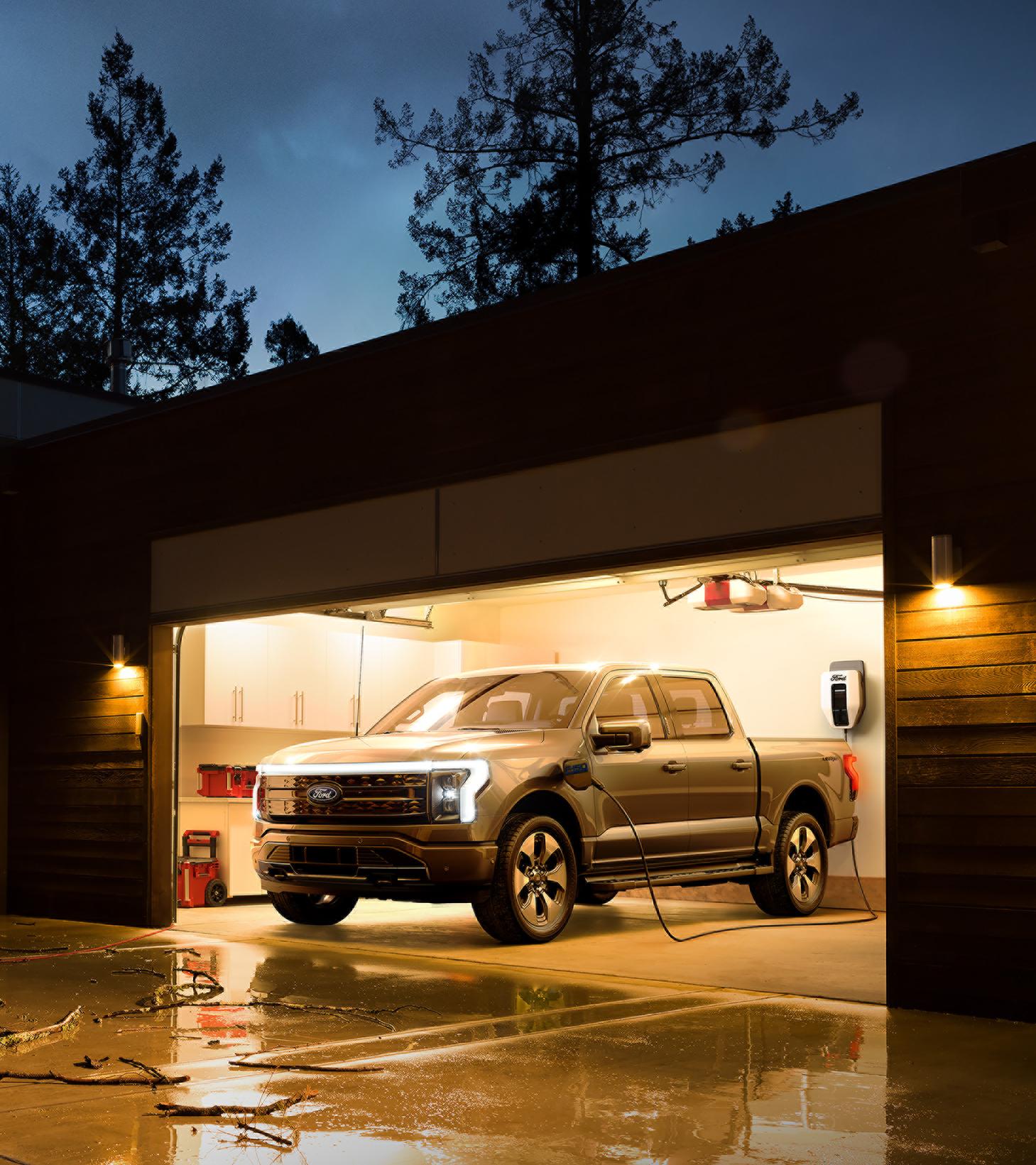 2025 F-150 Lightning parked in garage at night while plugged into charger