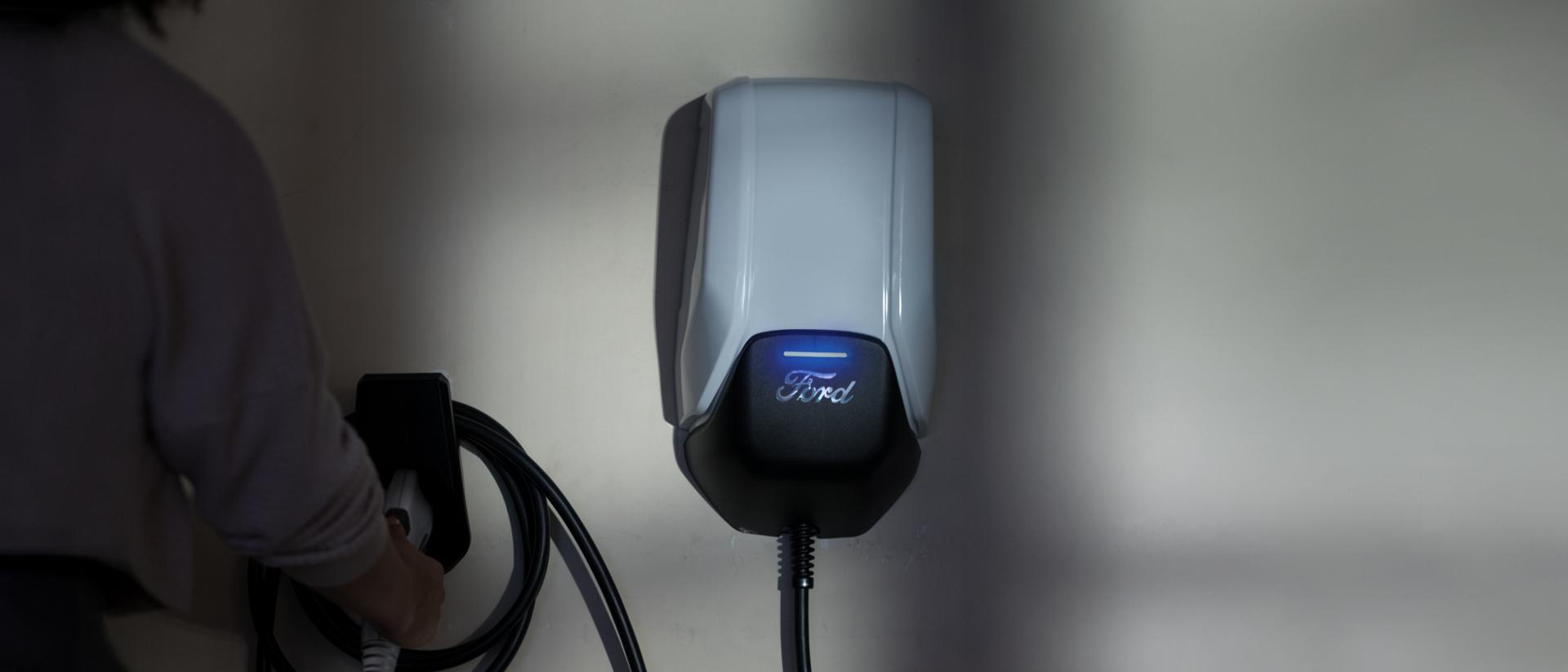 Ford charge station installed on interior wall of garage