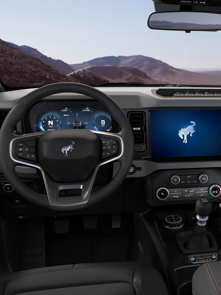 The dashboard of a 2026 Ford Bronco® SUV, showing the digital cluster and touchscreen