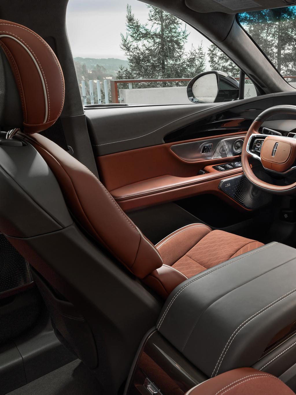The spacious cabin of a 2025 Lincoln Black Label™ Nautilus® SUV is shown in the Redwood theme