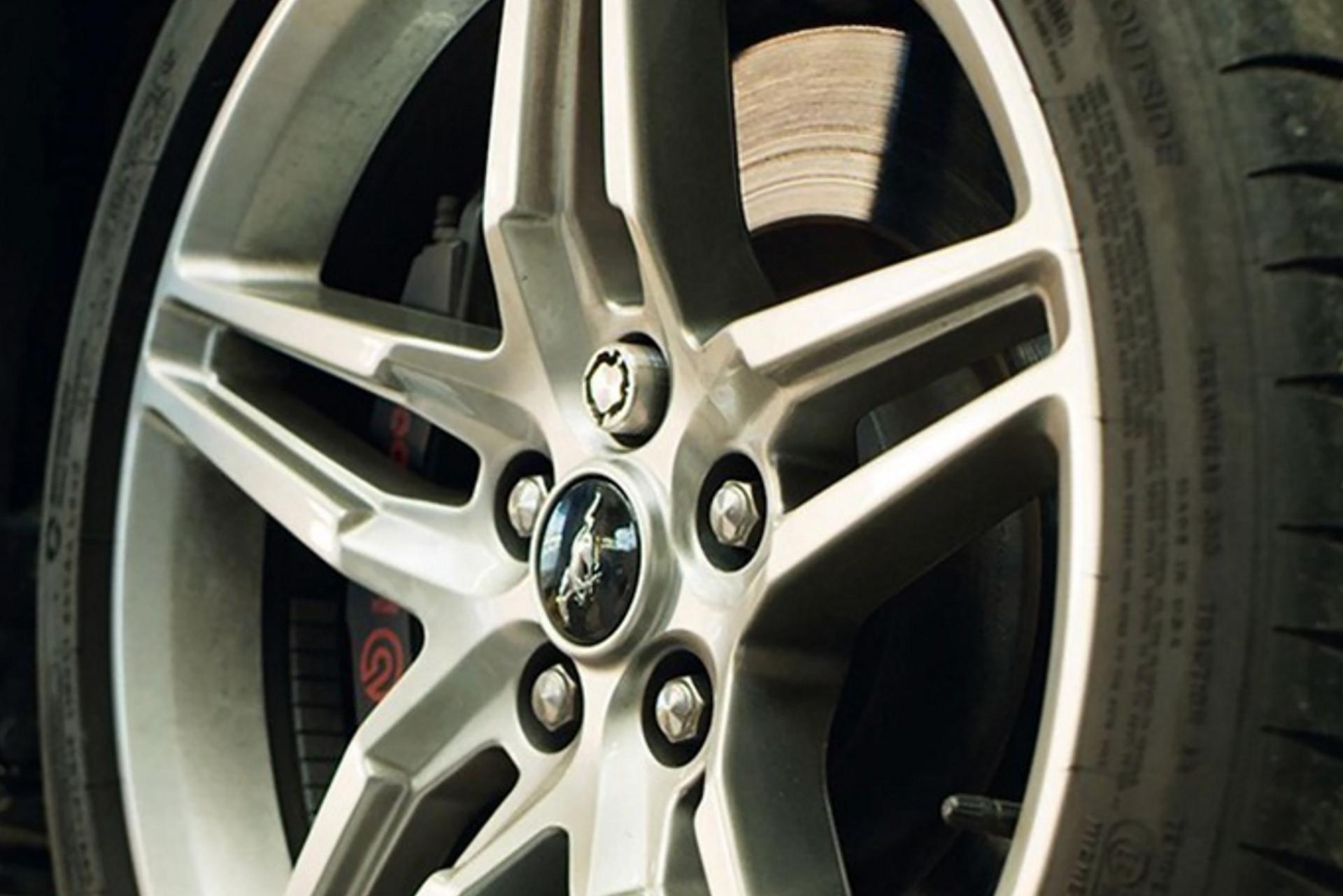 A 3D printed locking wheel nut on a Mustang rim