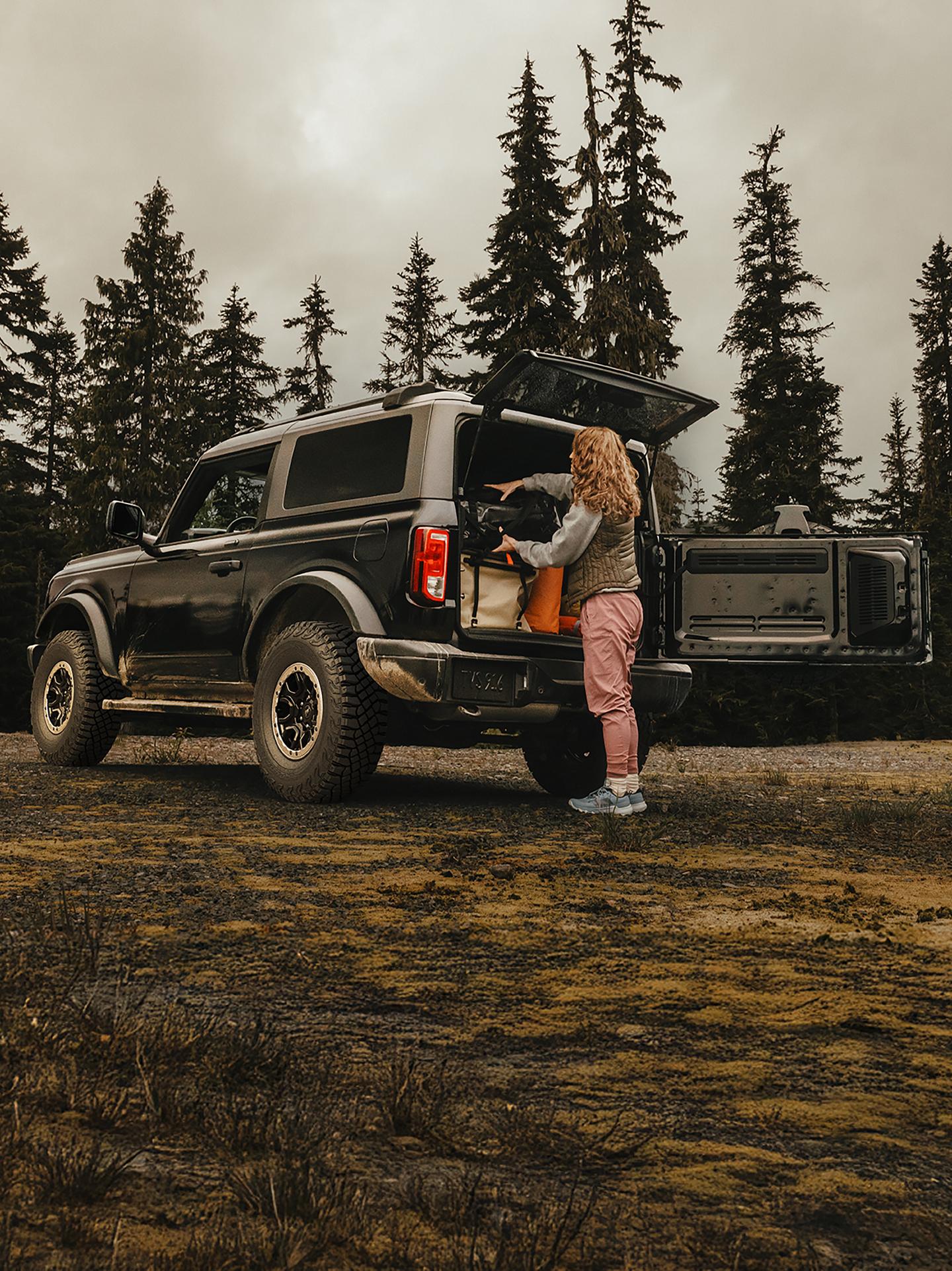 A 2026 Ford Bronco® SUV with the rear door open showing a loaded cargo area