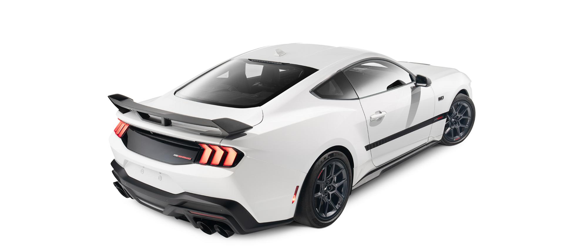 Front three-quarter view of the white Mustang with the modular grille and front splitter