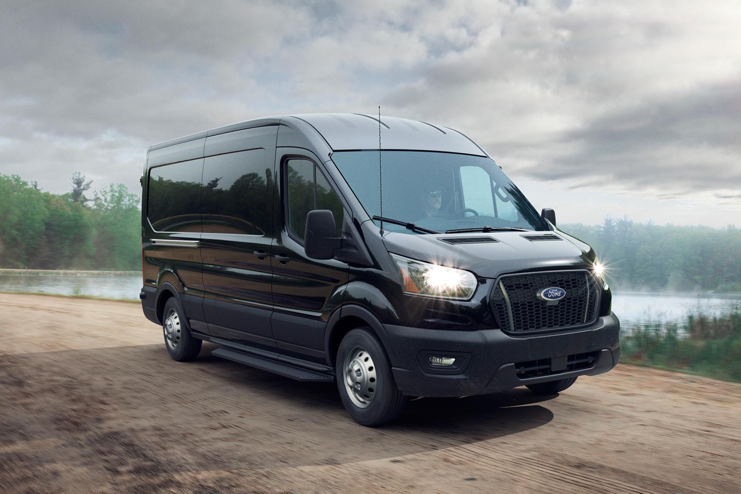 A 2026 Ford Transit® van driving down nature road