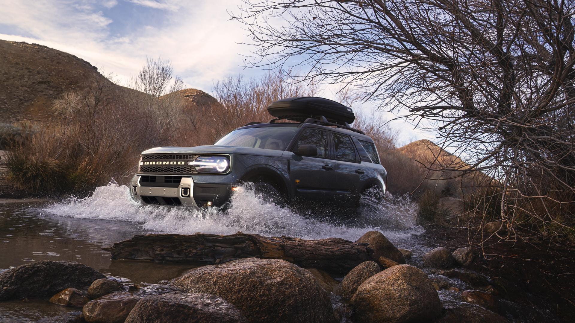 A 2026 Ford Bronco Sport® being driven through a small river