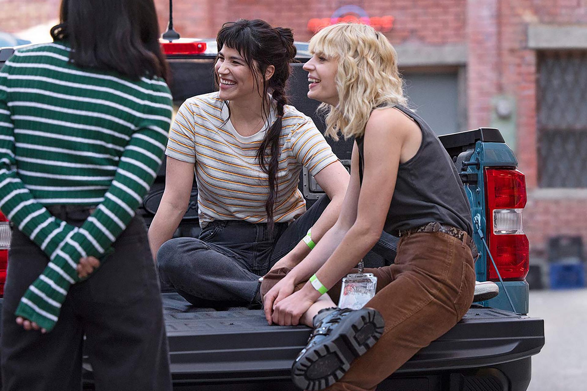Friends gathering in pickup bed