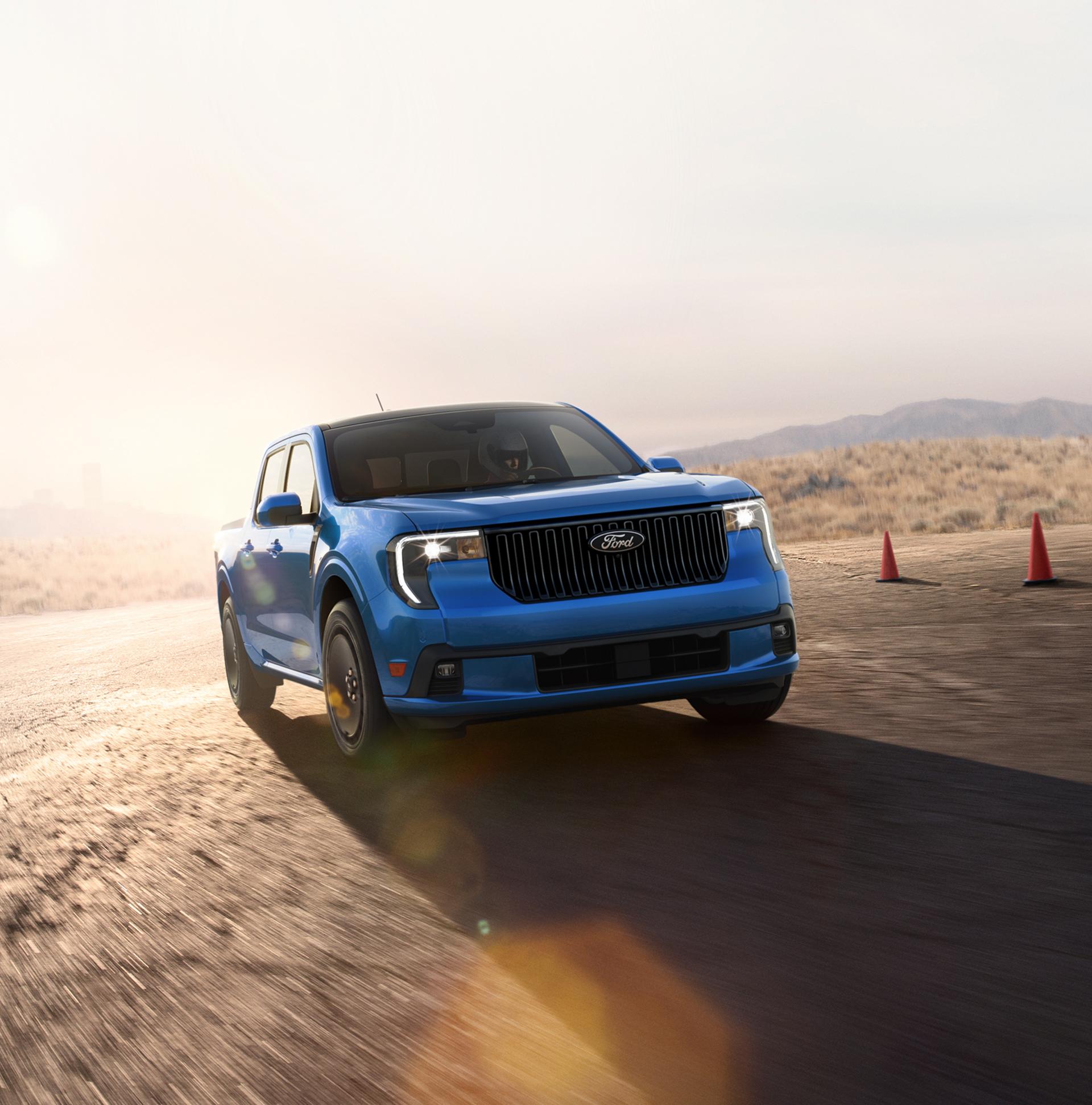 2026 Ford Maverick Lobo® model being driven on a closed course at dusk