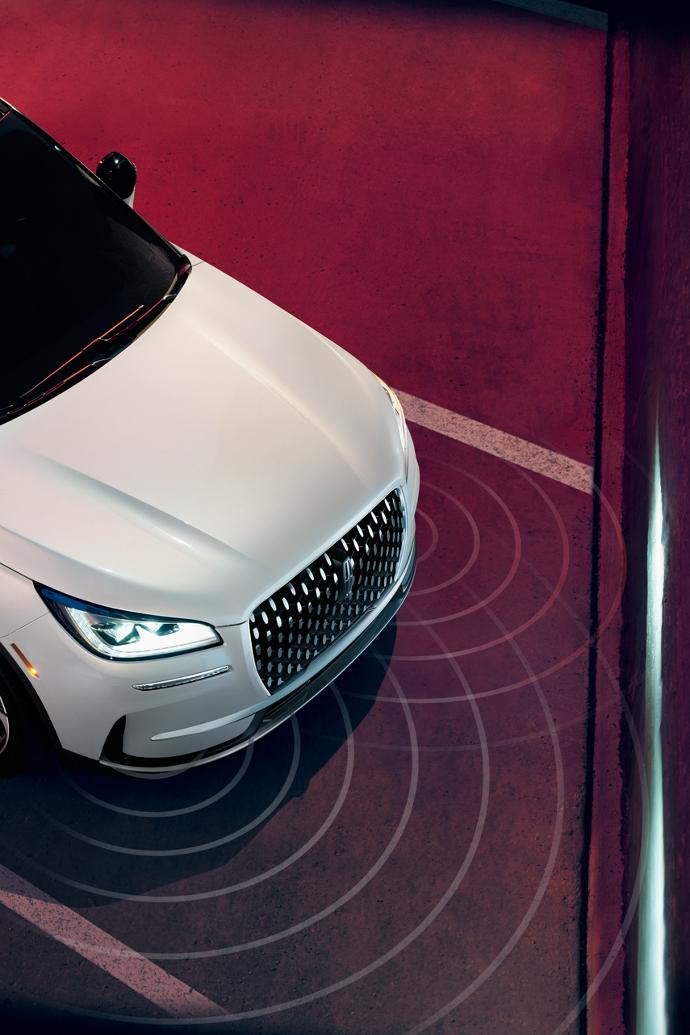 Simulated sensing waves emit from a 2026 Lincoln Corsair® SUV to demonstrate Pre-Collision Assist