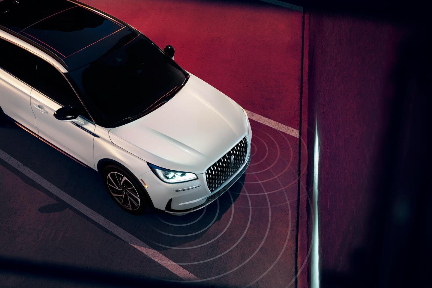 Simulated sensing waves emit from a 2026 Lincoln Corsair® SUV to demonstrate Pre-Collision Assist