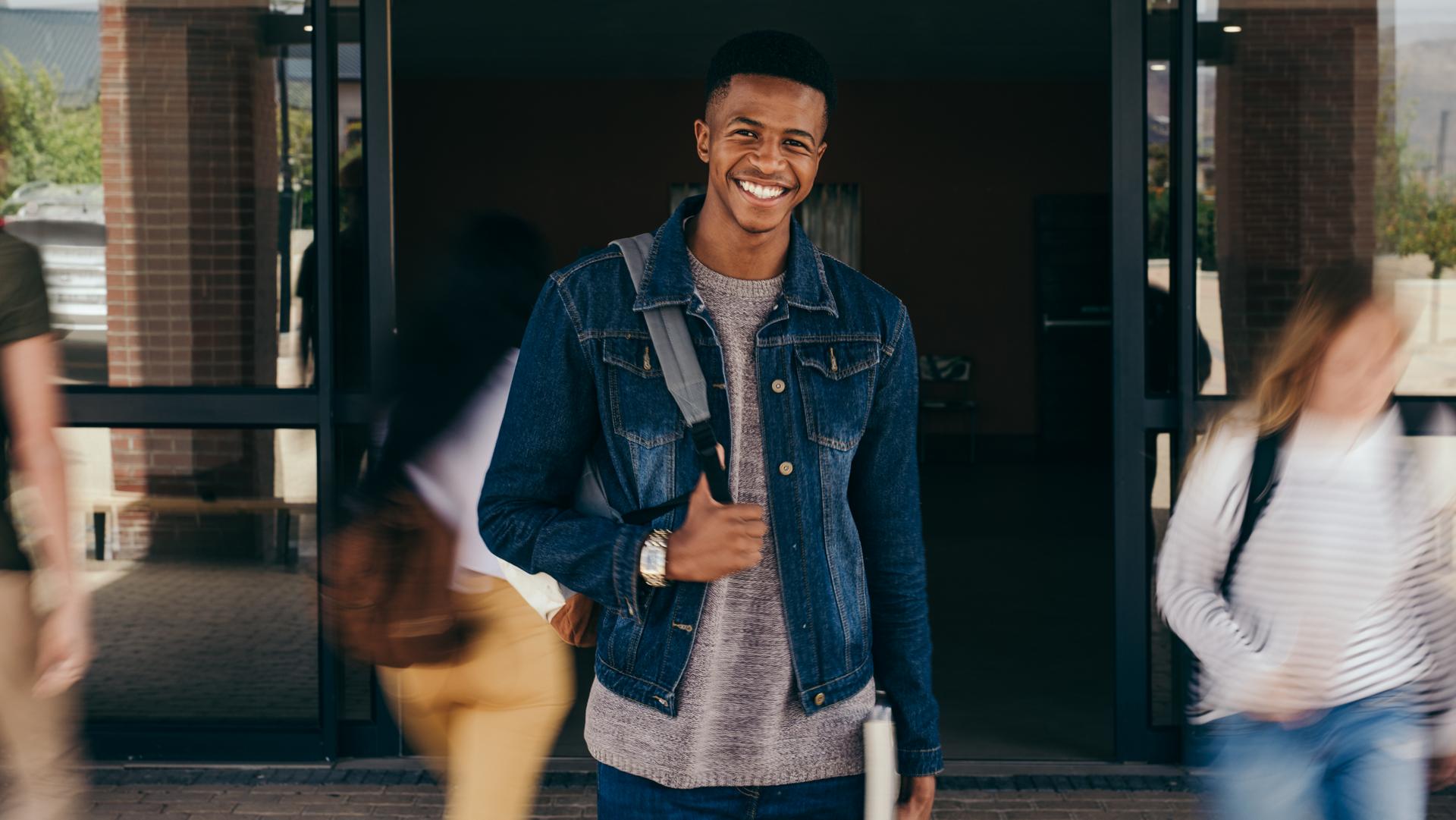 A young man wearing a backpack