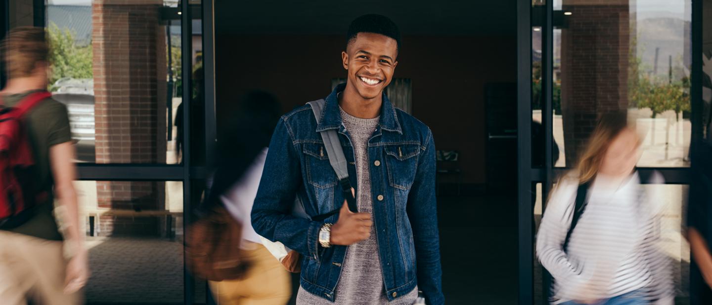 A young man wearing a backpack