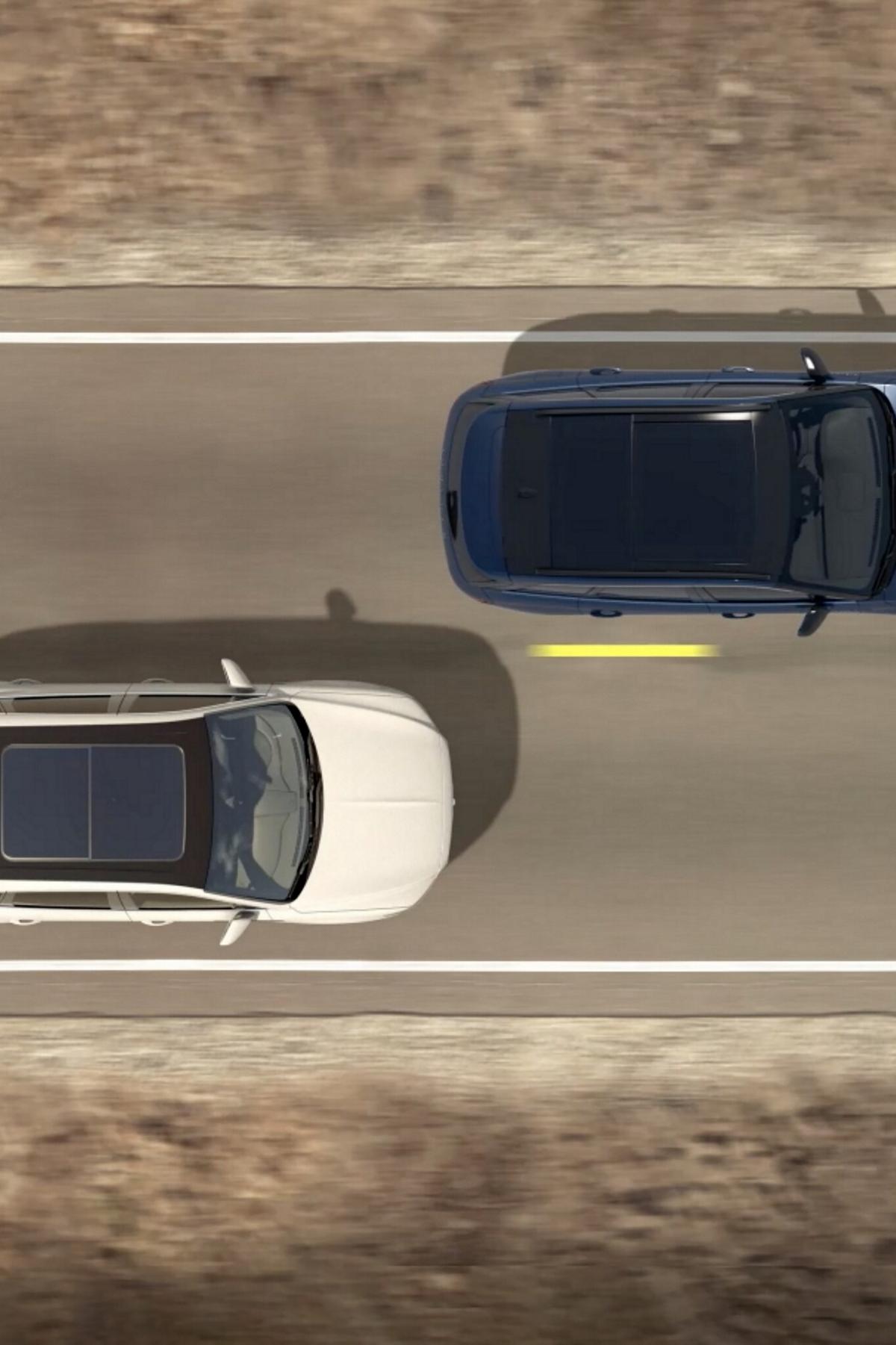 An overhead illustration of two cars being driven indicates how blind spot detection